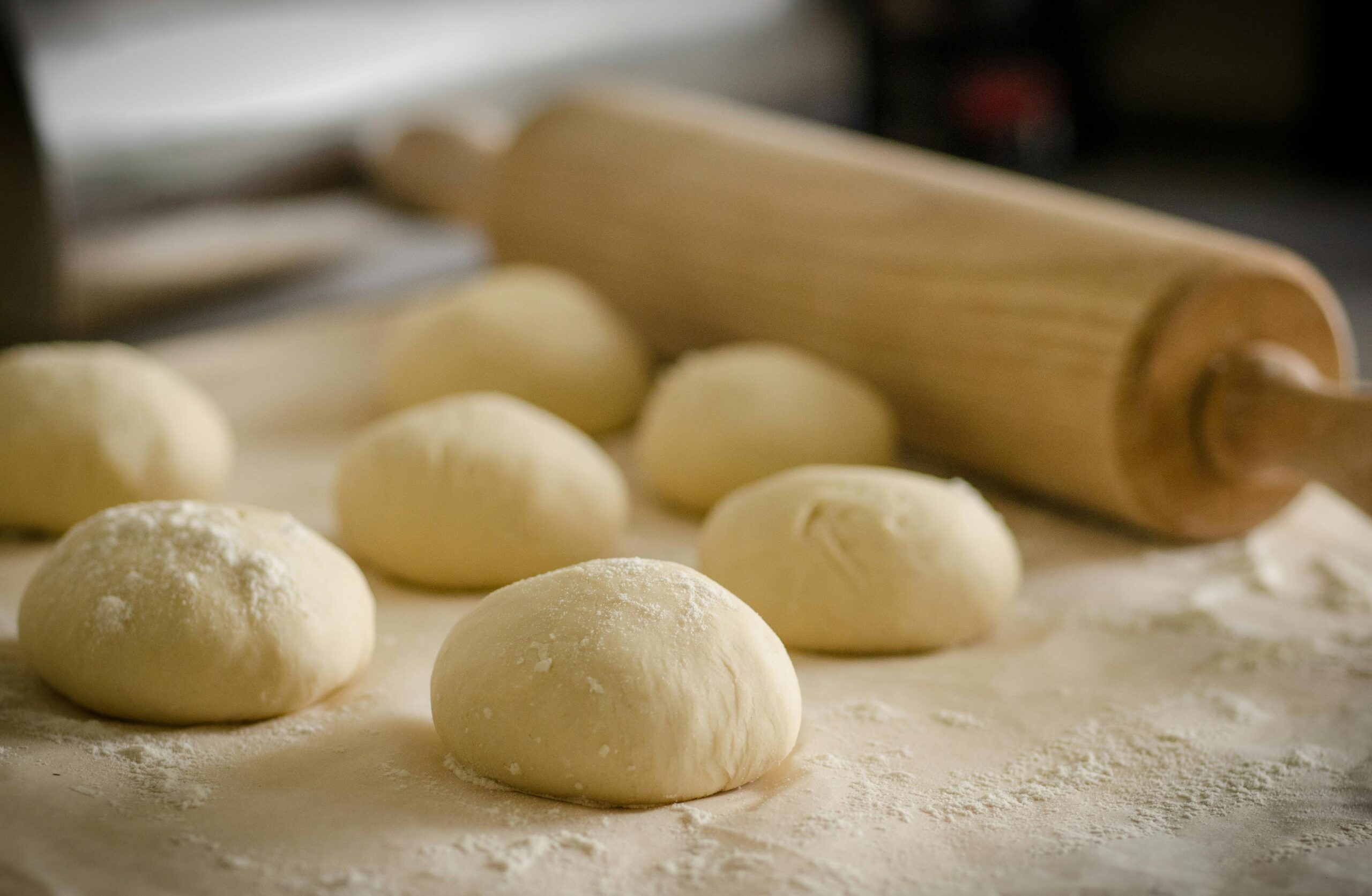 Bakery enzymes enhancing dough strength, elasticity, and volume