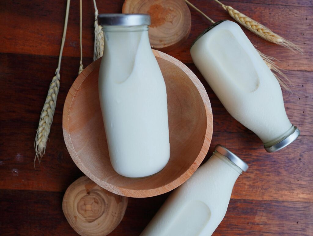 Milk bottle representing dairy enzyme applications for enhanced processing efficiency
